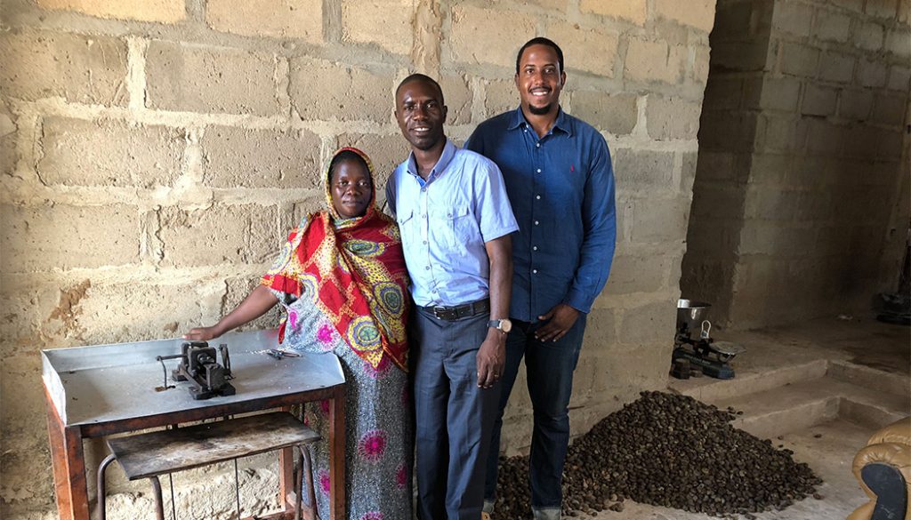 YYTZ cofounder Fahad Awadh with a woman from a women's cashew processing group