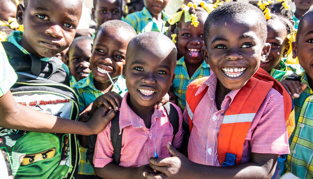 School children in Haiti smile together