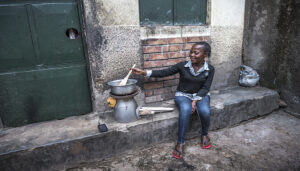 BrightLife client cooking using BioLite cookstove