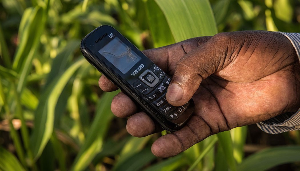 Client-Holding-Mobile-Phone