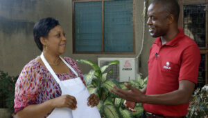Jane-Speaking-With-A-FINCA-Officer