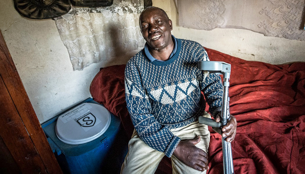 Customer in Kenya with a Blue Box container-based toilet