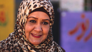 Najla, Smiling in Front of Her School