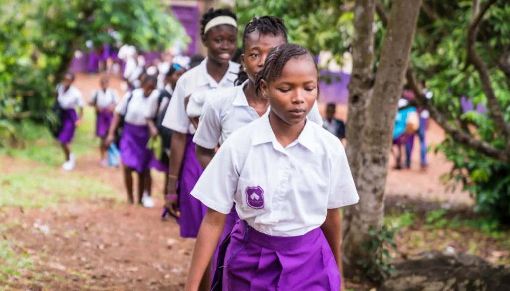 School girls from Rising Academies walking