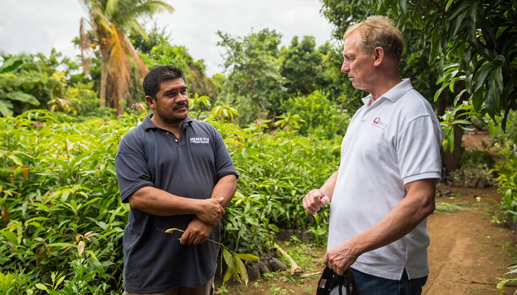 Rupert Scofield meets with a FINCA client and farmer in Nicaragua