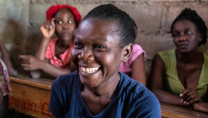 Woman at Village Bank meeting in St Marc, Haiti.